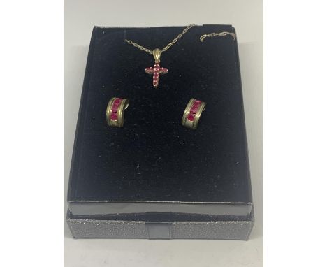 A SILVER NECKLACE WITH A RUBY CROSS PENDANT AND A PAIR OF MATCHING EARRINGS IN A PRESENTATION BOX 