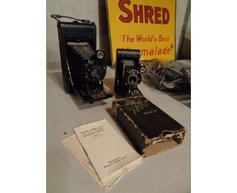 A VEST POCKET KODAK MODEL B 'AUTOGRAPHIC' IN BOX WITH INSTRUCTION MANUAL. ALSO A HOUGHTON LONDON BELLOWED CAMERA 