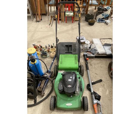 A FLORA BEST LAWN MOWER WITH GRASS BOX AND BRIGGS AND STRATTON PETROL ENGINE 