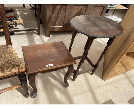 A MAHOGANY LAMP- TABLE ON CARVED CABRIOLE SUPPORTS AND AN OAK OCCASIONAL TABLE ON BARLEY TWIST SUPPORTS 