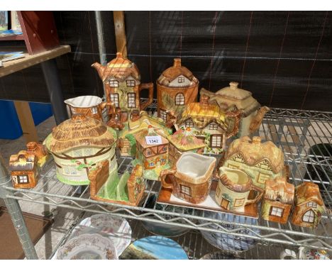AN ASSORTMENT OF COTTAGE CERAMIC WARE TO INCLUDE TEAPOTS, JUGS AND BUTTER DISH ETC 