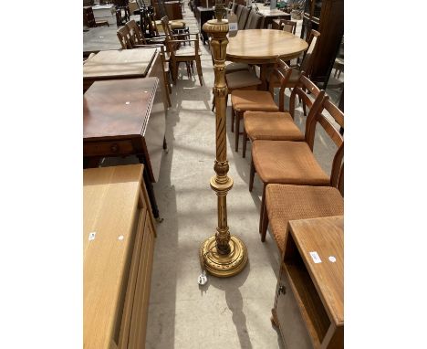 A GILT STANDARD LAMP ON TURNED AND FLUTED COLUMN