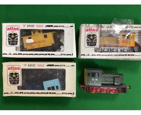Three Atlas 'O' Gauge/7mm U.S.A Outline 0-6-0 Industrial "Switchers"; a Union Pacific in overall yellow, a Santa Fe in blue a