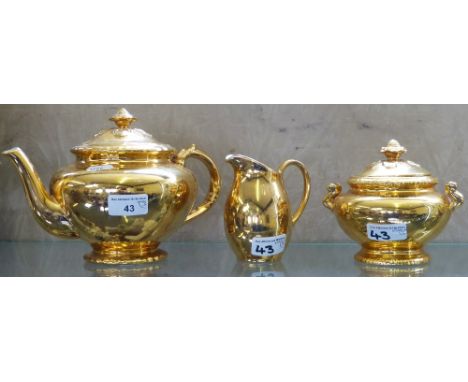 A Royal Worcester gilt, three piece tea service