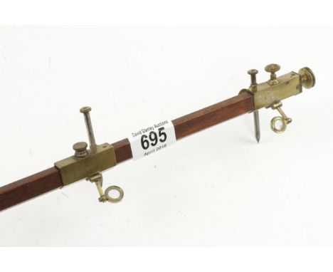 A brass beam compass with steel points and magnifying glasses G