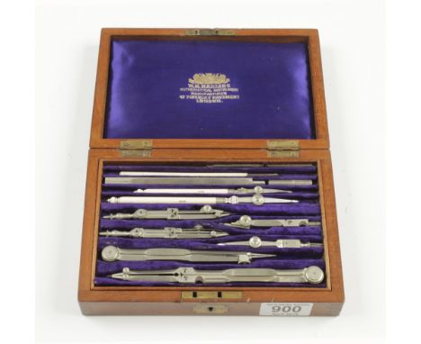 A German silver drawing set by W.H.HARLING with ivory pens and scale rule and an unnamed parallel rule in orig fitted lockabl