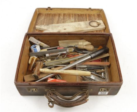A small kit of jewelers tools contained in a leather suitcase G