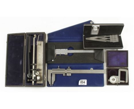 Two caliper gauges, a planimeter, a spacing divider and a micrometer G+