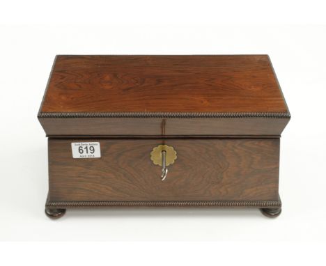 A pretty rosewood tea caddy with two foil lined boxes and glass bowl. 13" x 7 1/2" x 7" with rope work decoration bun feet an