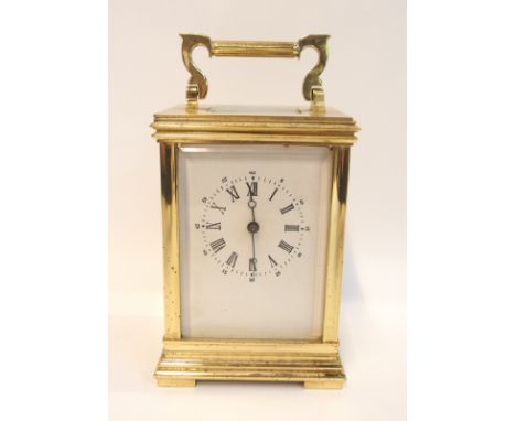 A Fema brass cased carriage clock, 14cm high Condition Report: has a cardboard face, lacquer wearing on case, Cannot guarante