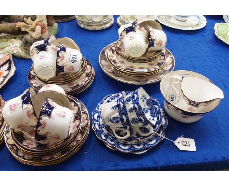 A Duchess China teaset decorated with rosebuds comprising milk jug, sugar bowl, cake plate, 11 cups, 11 saucers and 12 plates