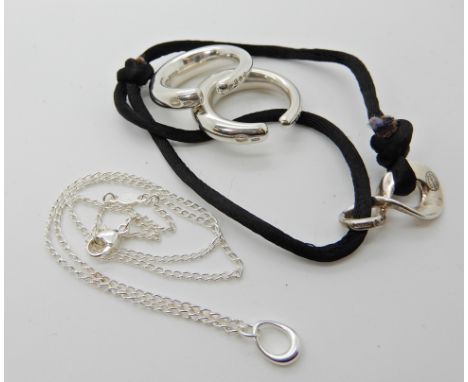 A collection of Georg Jensen items to include silver 'Ditzel' ear cuffs pattern number A29C, a silver 'Infinity' cord bracele