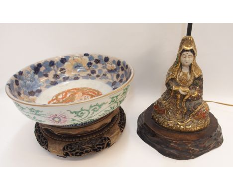 A Japanese Fukugawa porcelain bowl, decorated with a phoenix and peonies to the interior and flowers and foliage to the exter