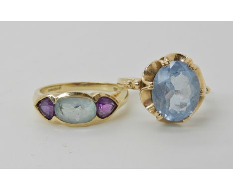 A 9ct gold blue topaz and amethyst ring, size K1/2 and a 9ct gold blue gem ring size K1/2, weight together 4.3gms Condition R