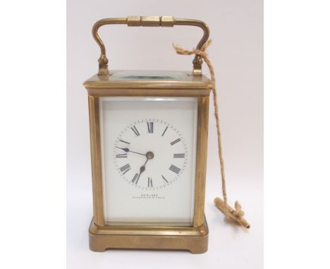 A brass cased carriage clock, retailed by Cowland, Sunderland &amp; Paris, 13cm high Condition Report: Available upon request