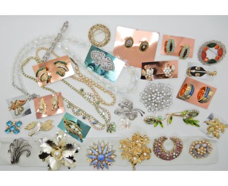 A deco clip and a collection of vintage brooches earrings and other items Condition Report: Available upon request