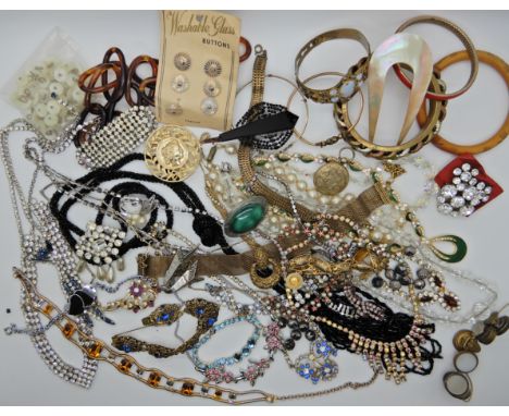 A collection of vintage costume jewellery to include buttons, diamante etc Condition Report: Available upon request