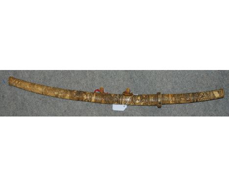 A Japanese sword with decorative hilt and scabbard, the blade 40cm, overall 75cm Condition Report: Available upon request