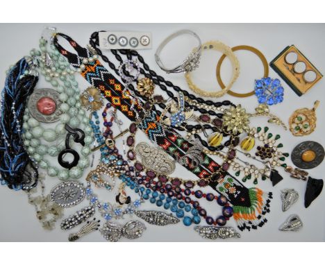 A collection of vintage costume jewellery to include, Deco clips, 1st nation bead work necklace, and other items Condition Re