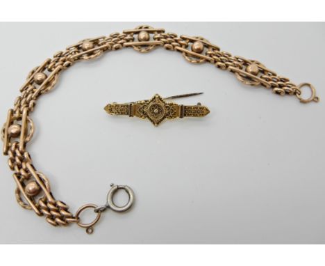 A 9ct gold fancy link bracelet length 20cm and a 9ct gold Etruscan design brooch (af) weight of both item together 16.3gms Co