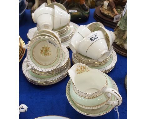 A Paragon bone china twelve setting teaset comprising; twelve cups, saucers and plates, milk jug, sugar bowl and two cake pla