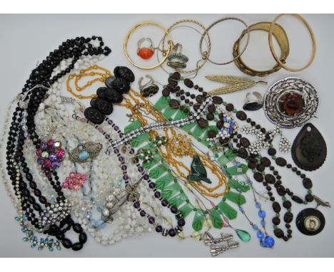 A collection of vintage costume jewellery to include a Bakelite necklace, Max Neiger Scarab beads, large plaid brooch etc Con