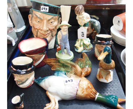 A Beswick flying duck, a standing mallard, a Doulton figure (def), a Royal Worcester figure Johnnie (def), Doulton character 