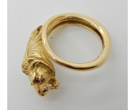 An 18ct gold unusual lion shaped ring with ruby eyes, finger size P, weight 10.8gms Condition Report: Light general wear. 