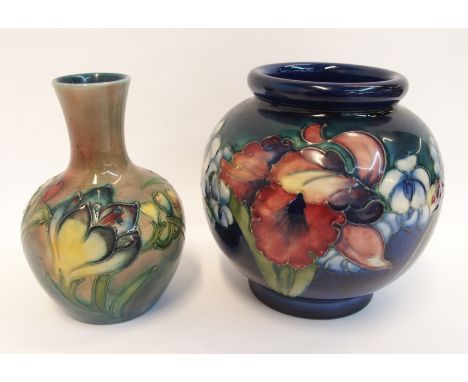 A Moorcroft flambe freesia vase, 12cm high together with a Moorcroft frilled and slipper orchid bulbous vase, 13cm high (2) C