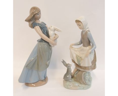 A Lladro figure of a girl and a rabbit and a Nao example Condition Report: Both in good condition. 