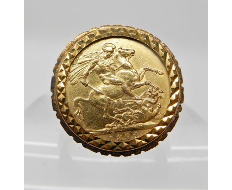 A full gold sovereign dated 1892, mounted in a 9ct gold ring, size approx X, weight 16.6gms Condition Report:Marks to soverei