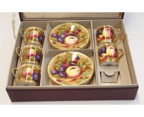 A boxed set of Aynsley fruit decorated coffee cans and saucers Condition Report: only 5 cup, and 6 saucers. 