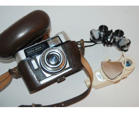 A Zeiss Ikon Colora camera, modern miniature binoculars and metre Condition Report: Available upon request