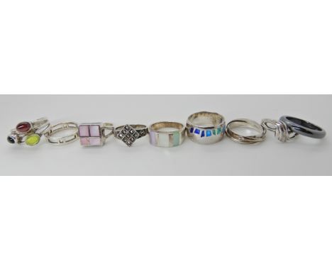 Eight silver rings to include a plique a jour enamel ring and a further Hematite ring Condition Report: Available upon reques