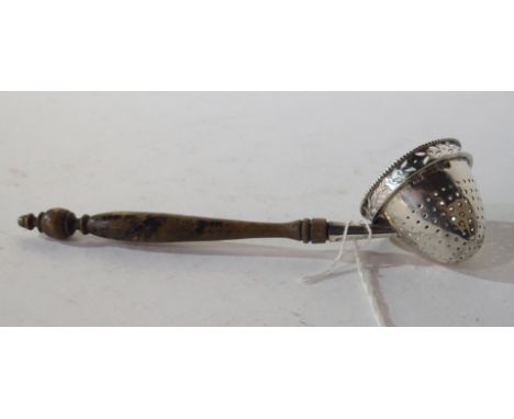A silver straining ladle, maker's mark RH London, import marks, 16.5cm long with turned wooden handle Condition Report: Avail