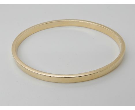 A yellow metal bangle no hallmark, inner dimensions 6.3cm x 5.3cm, weight 22.2gms Condition Report: Light general wear, no ha