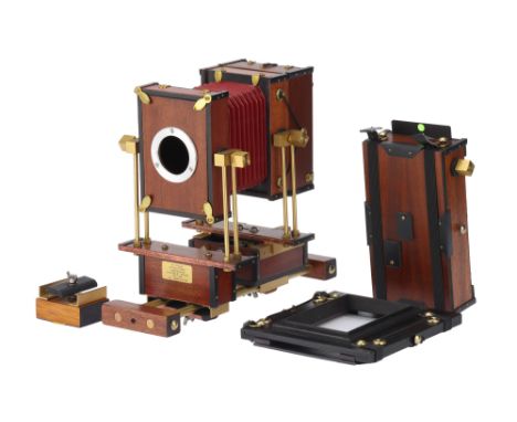 A W. Stacey 69 Mahogany Technical Camera,1985, body, VG-E, various backs including a roll film 6x9 example, complete with ori