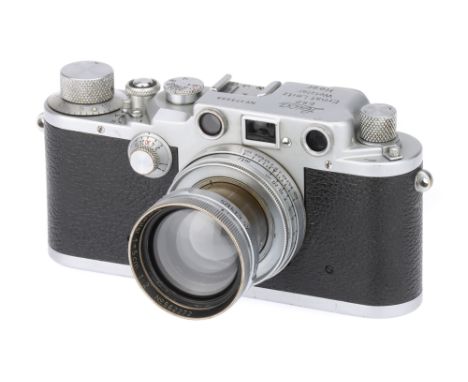 A Leica IIIc 'Heer' Rangefinder Camera,1941/42, chrome, serial no. 379909, with Leitz Summitar f/2 50mm lens, 1940, chrome, s