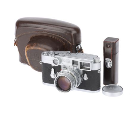 A Leica M3 Rangefinder Camera,1963, chrome, serial no. 1072995, with Leitz Summicron Dual-Range f/2 50mm lens, 1957, chrome, 