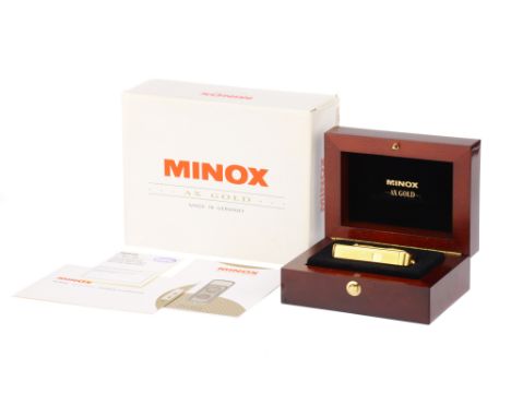 A Minox AX Gold Sub-Miniature Camera,1994, gold, serial no. I-168, body, VG-E, shutter working, lens, VG, complete with prese