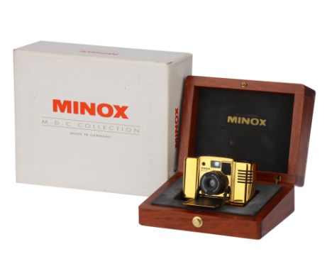 A Minox 35 M.D.C Collection Gold Compact Camera,1993, gold, serial no. 7800123, with Minolta MC Minoxar f/2.8 35mm lens, body