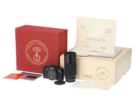 A Leica R4 'Jesse Owens' Golden Anniversary Camera,1987, black, serial no. 1672558, with Leitz Vario-Elmar-R f/4 70-210mm len