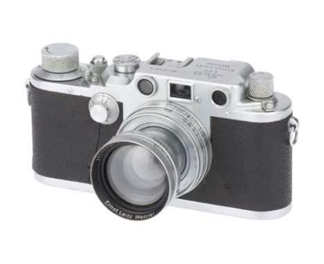 A Leica IIIc Red Blind Rangefinder Camera,1940, chrome, serial no. 365875, with Leitz Summitar f/2 50mm lens, 1940, chrome, s