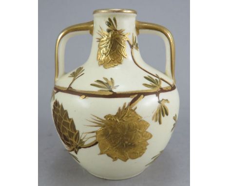 A late nineteenth century Wedgwood two-handled vase, in the Portland Vase shape. It is decorated with raised gilding with pin