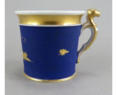 An early nineteenth century Chamberlain Worcester porcelain cup, c. 1815. It is decorated with a gilded church and birds and 