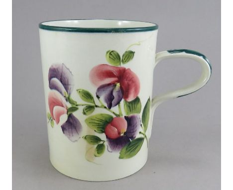 A large R H & S Wemyss ware hand-painted floral mug, c. 1900. It is marked to the underside. 14.5cm tall. (1)Condition: Short