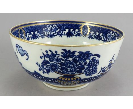 An eighteenth century blue and white transfer-printed porcelain Worcester Bat pattern waste bowl, c. 1770-80.  Gilded details