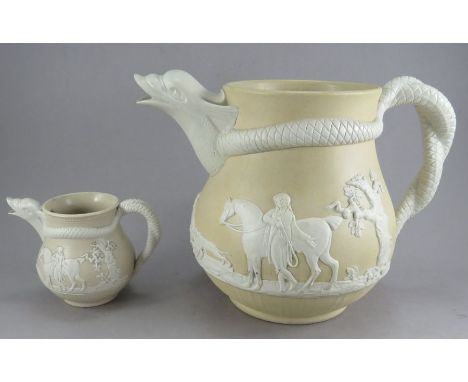 Two early nineteenth century chrysanthemum mark moulded stone ware hunting scene jugs, c. 1810-20. Both have dolphin-head spo