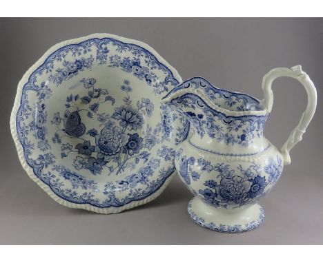 An early nineteenth century blue and white transfer-printed wash bowl and ewer, possibly Minton, c. 1830. It is decorated wit