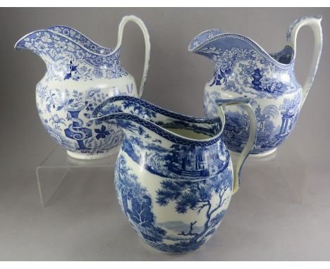 Three early nineteenth century blue and white transfer-printed ewer jugs, c. 1820-30. To include:  Minton Florentine, a wrap-